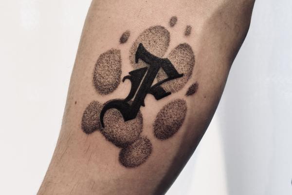 Blackwork Dog Footprint Tattoo