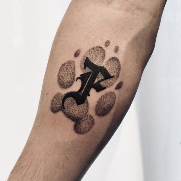 Blackwork Dog Footprint Tattoo