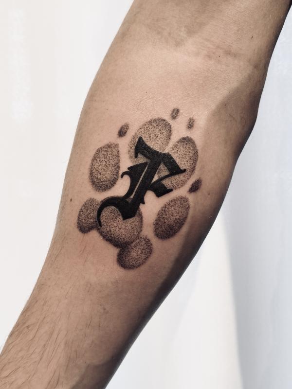 Blackwork Dog Footprint Tattoo