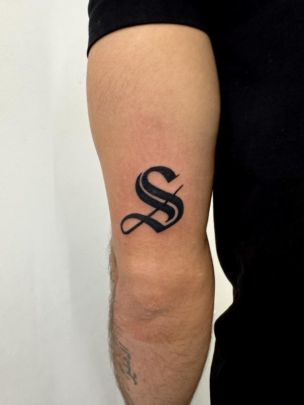 Blackwork Script S Tattoo