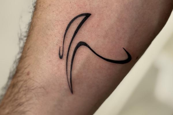 Fineline Abstract Pickaxe Tattoo